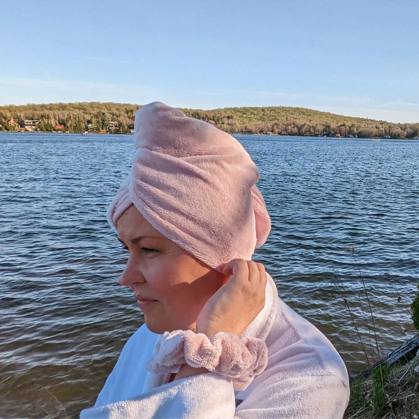 woman wearing grey luxe micro cotton bamboo hair towel and matching grey towel scrunchie perfect for using the hair drying towel for travel