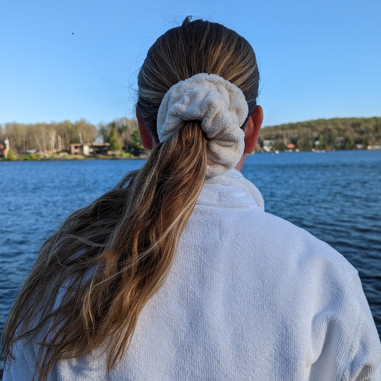 woman wearing ivory microfiber scrunchie in her hair , pony tail at the cottage